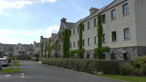 DOONBEG- 8.27.2023 -Exteriors of ivy-covered hotel accommodations at the Trump Stock Footage 254115393