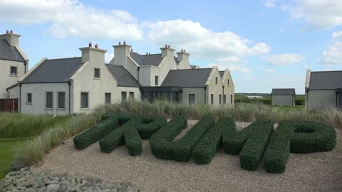 DOONBEG- 8.27.2023 -Topiaries spelling out Trump's name stand in front of the Stock Footage 254114085