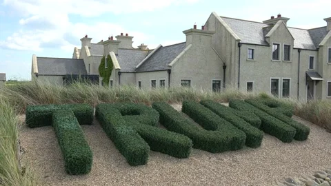 DOONBEG- 8.27.2023 -Topiaries spelling out Trump's name stand in front of the Stock Footage 254114223
