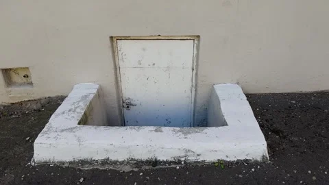 Door to an abandoned basement underground Stock Footage 306171668