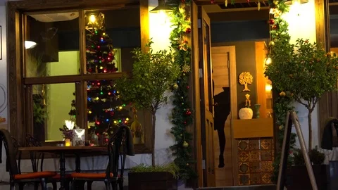 A Door and A Window of a restaurant or cafe  in the christmas evening Stock Footage 83796602