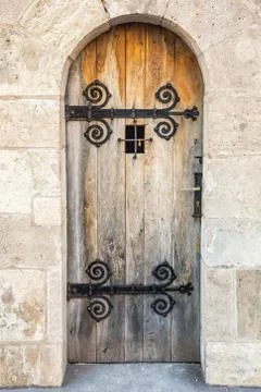 Door with bars on old wall Stock Photos