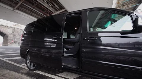 Door of black shiny car automatically closed on Stock Footage 299678744
