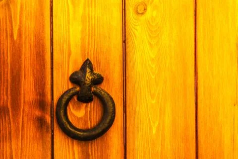 Door with brass knocker in the shape of a decor,  beautiful entrance Stock Photos