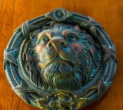 Door with brass knocker in the shape of a lion,  beautiful entrance to the ho Stock Photos