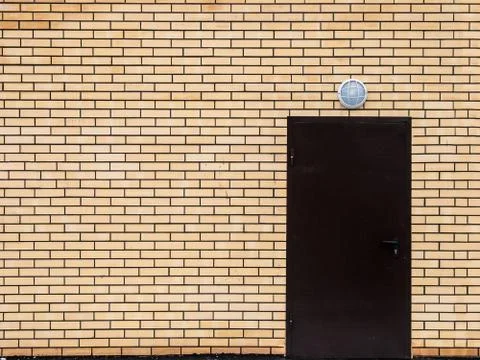 Door in a brick wall Stock Photos