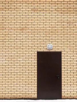 Door in a brick wall Stock Photos