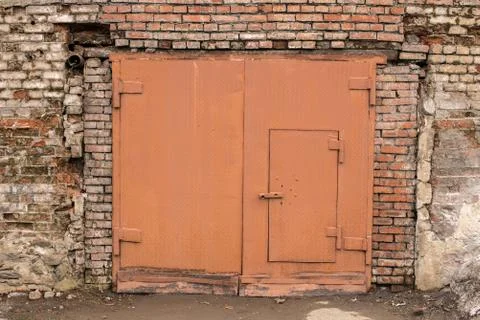 The door in the brick wall. Stock Photos