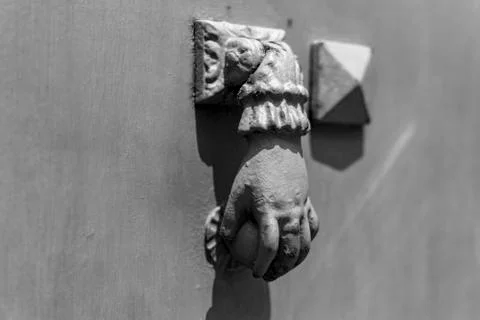 Door Clapper with the shape of an hand holding a globe Stock Photos