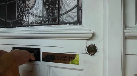 The door close-up. Human hand throws the magazine in the house. Video stock 68079632