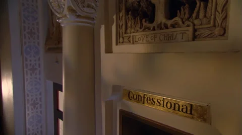 Door of confessional in Catholic church, man entering Stock Footage