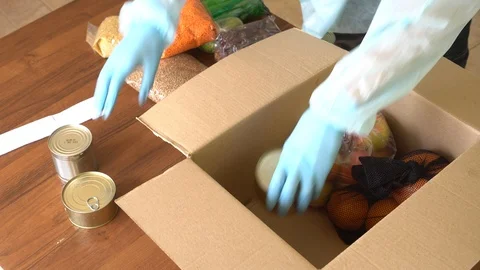 Door delivery. Order picker in protective suit, gloves and mask. Coronavirus Stock Footage 128096356