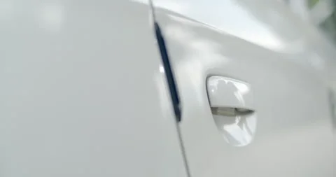 The door doesn't close completely.Open the car door and close it again tightly. Stock Footage 306395336