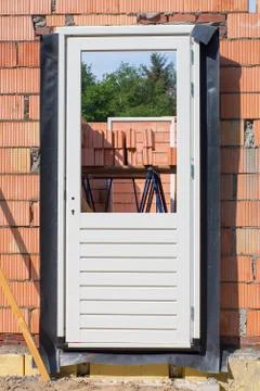 Door frame in wall on construction site Stock Photos