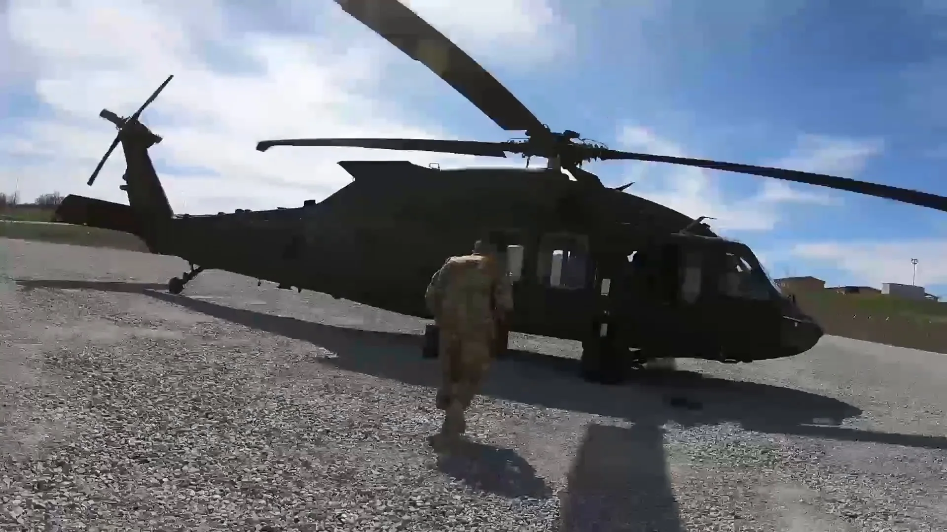 Door Gunner Carrying Ammunition Boxes To Waiting Helicopter Hi