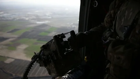 Door gunner positioning machine gun Stock Footage 87205149