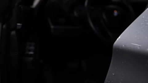 The door handle of a gray car, which a woman's hand grabs and opens the door. Video stock 246329415