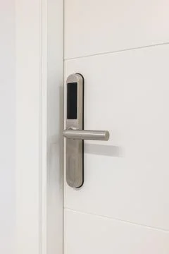Door handle with plastic card with microchip or digital code. Closeup of an Foto stock