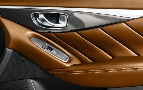 Door handle with power window control buttons of a luxury passenger car. Brow Stock Photos