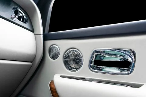 Door handle with power window control buttons of a luxury passenger car. Whit Stock Photos