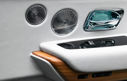 Door handle with power window control buttons of a luxury passenger car. Whit Photos