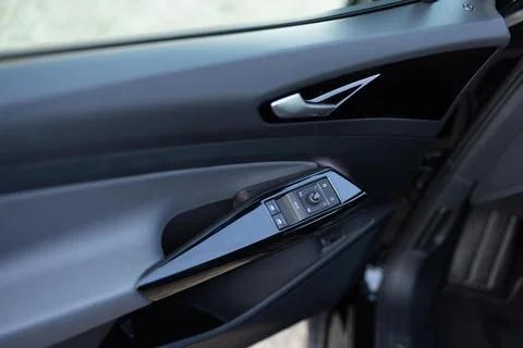 Door handle with power window control. Window control buttons in modern luxury Photos