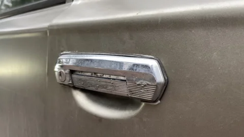 Door handle for the Soviet car VAZ-2101, the so-called Kopiyka, or Coin Stock Footage 241302720