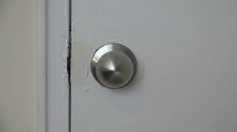 Door handle turns and opens Stock Footage