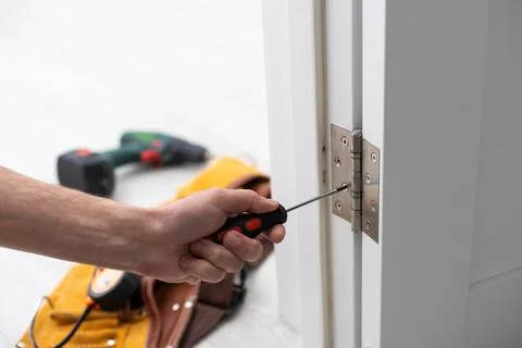 Door hinge installation. High quality photo Foto stock