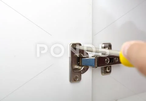 Door hinge installation. Stock Photos