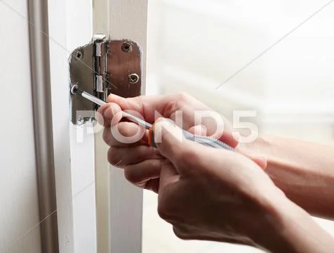 Door hinge installation. Stock Photos