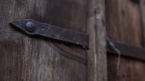 Door hinge of an old door in the forest with old steel Stock Footage 222933153