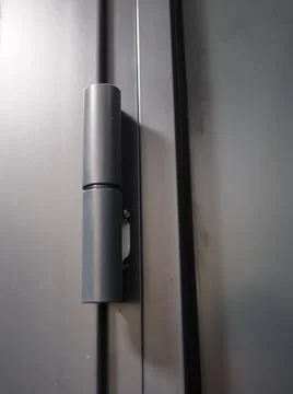 A door hinge is a type of hinge hinge. Fastening doors to the door frame Stockfoto's