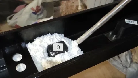 Door installation process. Polyurethane foam is squeezed onto a metal part Stock Footage 145731177