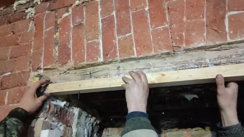 Door installation process. Polyurethane foam is squeezed onto a metal part Stock Footage 145731273