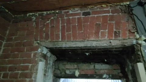 Door installation process. Polyurethane foam is squeezed onto a metal part Stock Footage 145731338