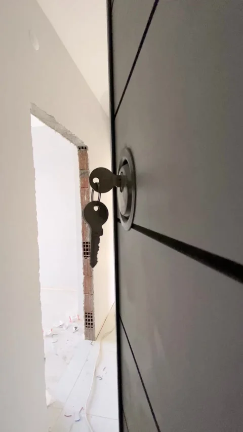 Door with keys, symbolizing a new beginning Stock Footage 299945132