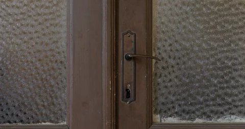 Door knob or handle moving and door opening in old house Stock Footage 126267640
