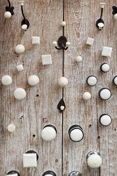 Door knobs Vintage style white door knobs at wooden board Copyright: xZoon... Fotos de archivo