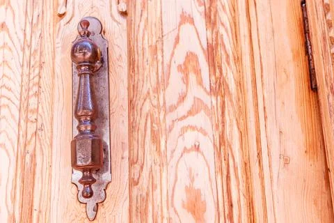 Door knocker architectural vintage texture background. Wooden entrance ornament Stock Photos