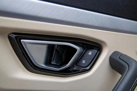 Door lock button on a door handle in a modern car Stock Photos