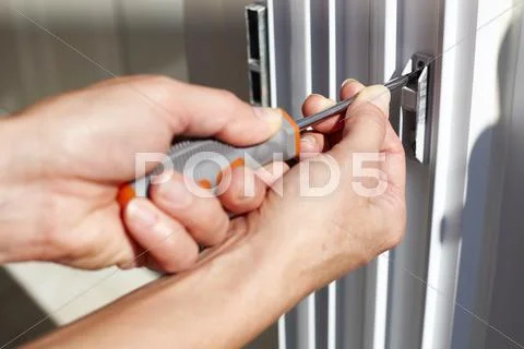 Door lock installation. Stock Photos