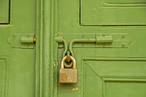 Door locked with a padlock Stock Photos