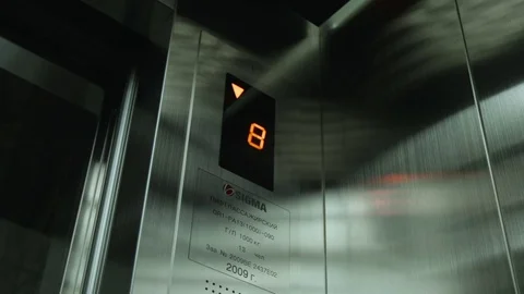 Door of modern Elevator closed. the Elevator goes down Stock Footage 73482795