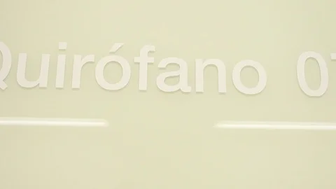 Door with modular operating theatre number 7 written on. 스톡 동영상 129899309