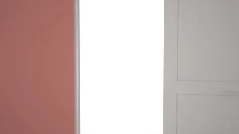 Door opens and a bright light flooding a dark room. Can be used as a concept of  Stock Footage 167231324