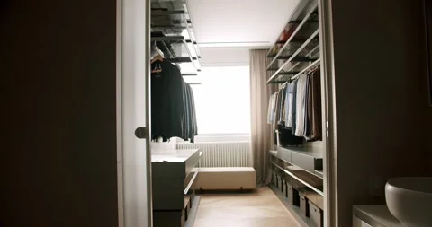 Door Opens in Dressing Room. Row of men suit jackets on hangers. wardrobe. Stock Footage 170384841