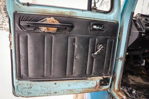 Door panel of an old truck with defect close-up Stock Photos