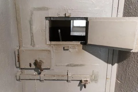 Door to the prisoner's cell, close up view. Stock Photos