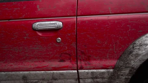 The door of the red car is a close-up in the mud. Stock Footage 266886955